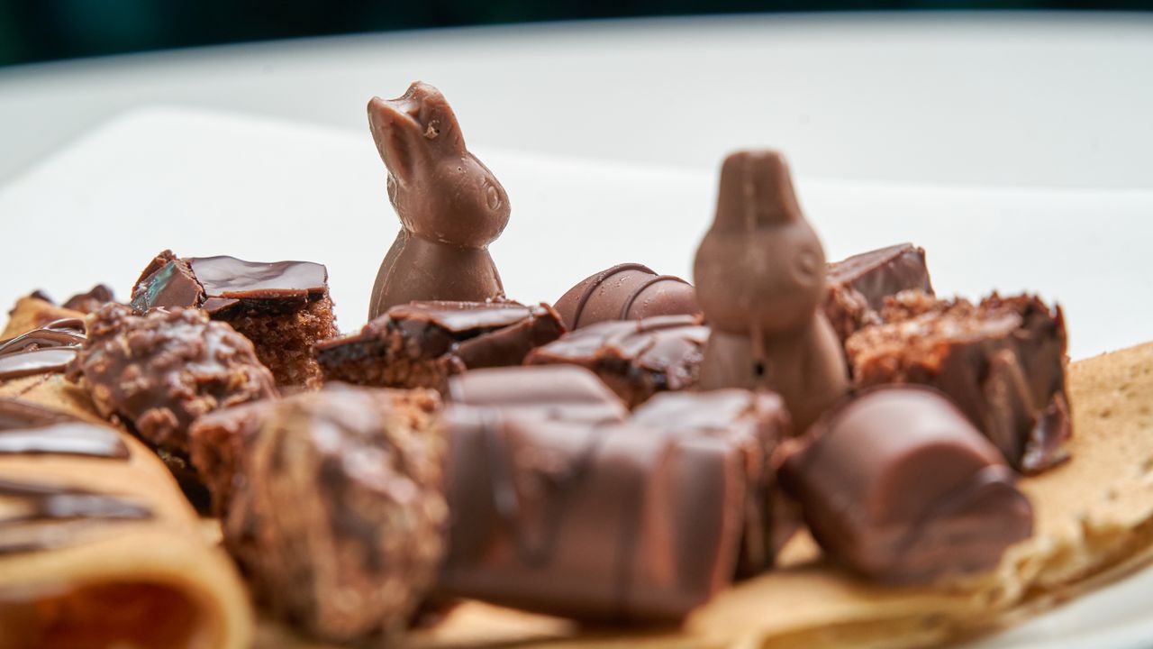 Home Close-up of assorted chocolate treats including rabbit-shaped chocolates on a dessert plate.